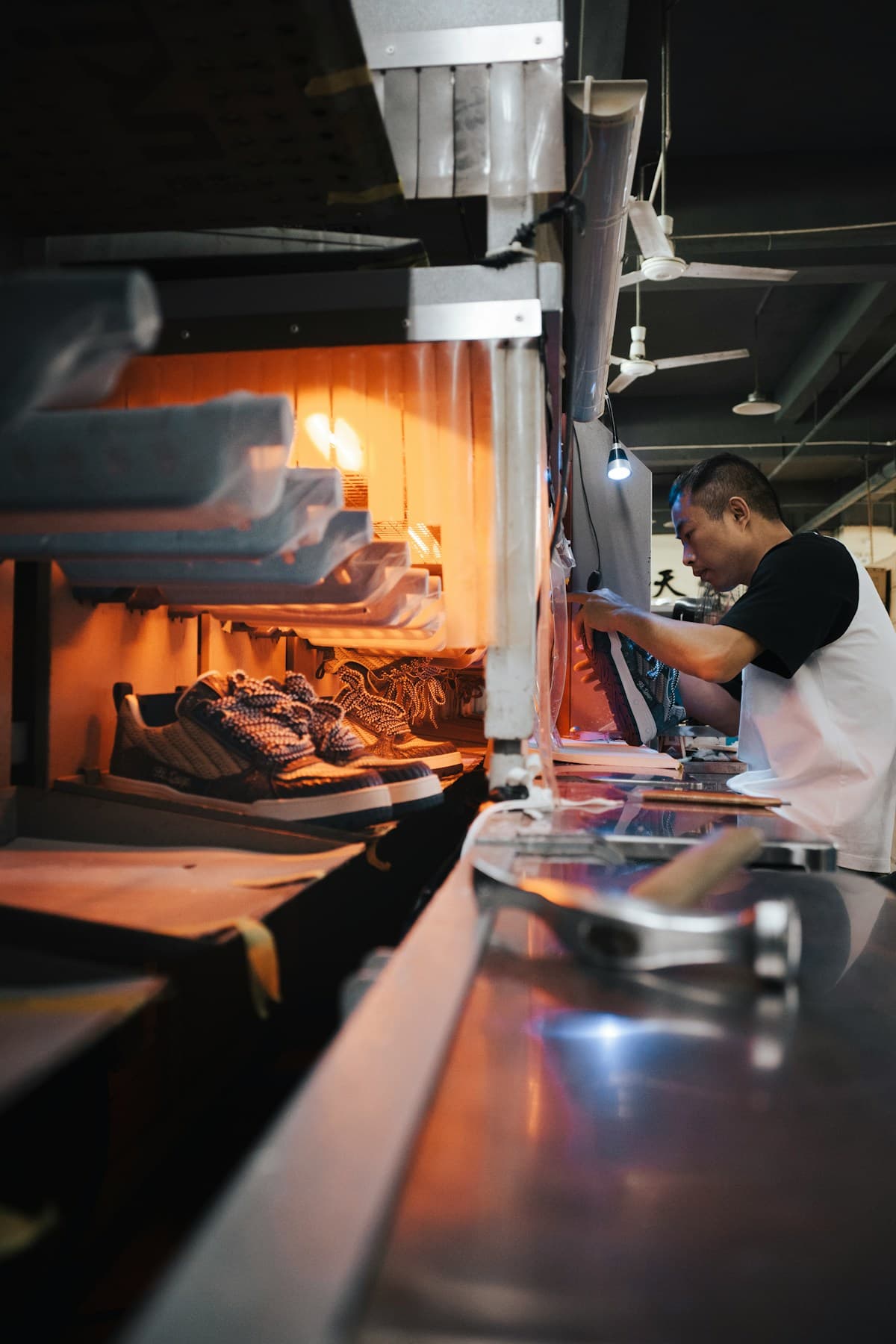 New manufacturing supervisor learning shop floor leadership on a production line